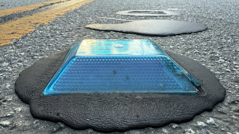 A blue raised pavement marker along Bear Creek Road in Boulder Creek, Santa Cruz County, California.