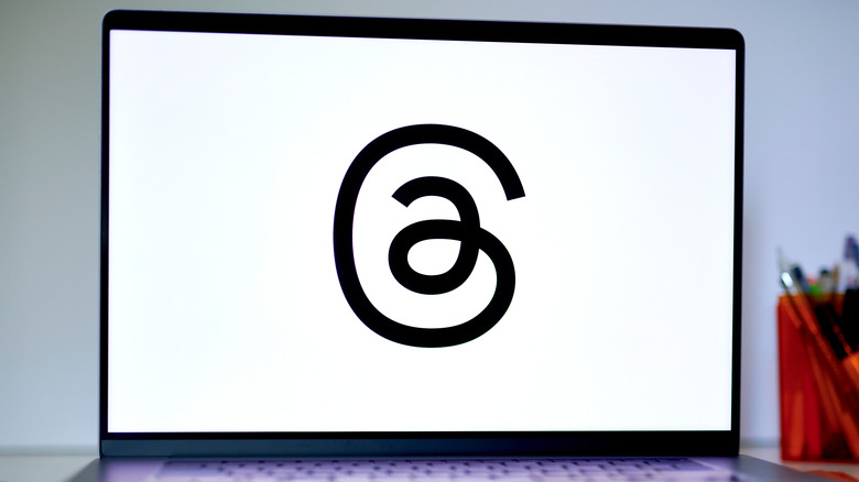 threads logo laptop