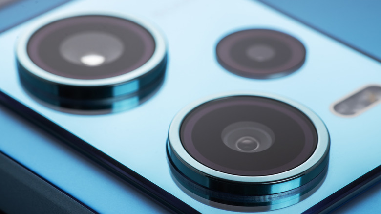 Close up picture displaying the lenses of a mobile phone camera