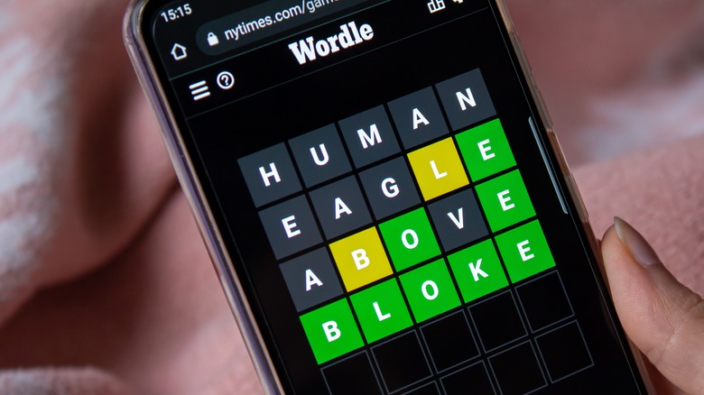 person playing Wordle on smartphone