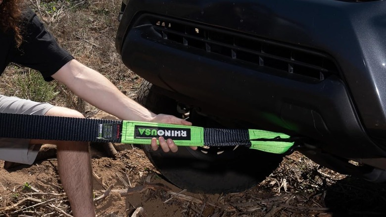 A person attaches a Rhino USA recovery strap