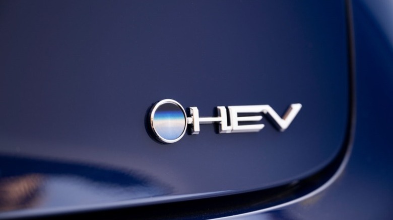 A hybrid electric vehicle badge on the rear of a Toyota Prius
