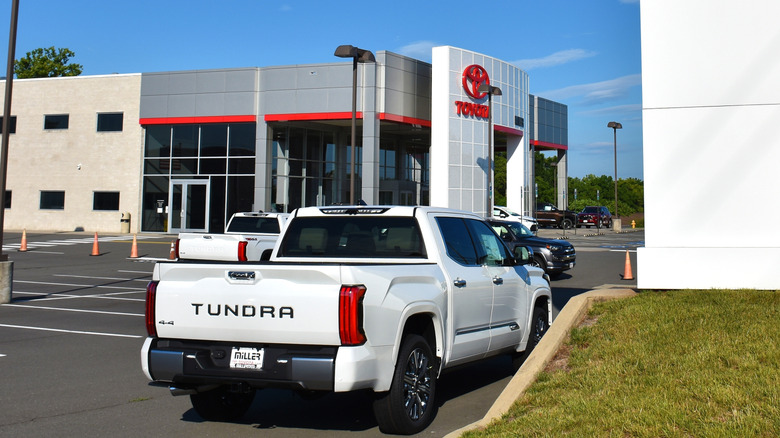 Toyota Tundra parked outside of a Toyota dealership
