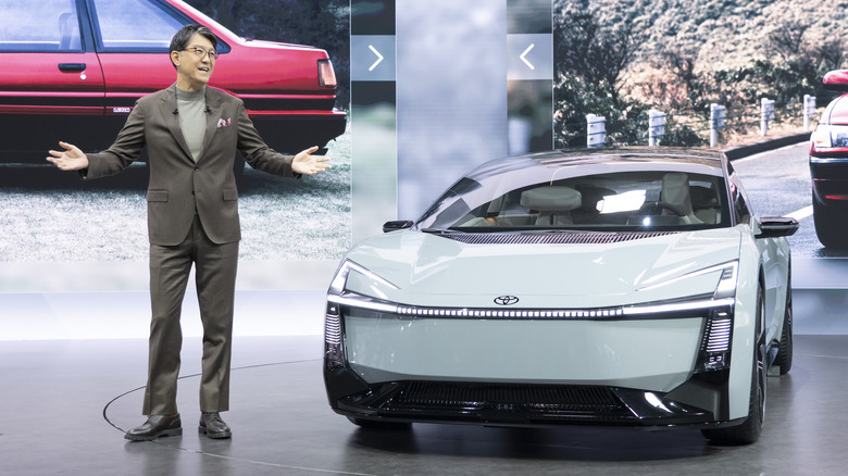 Toyota President and CEO Koji Sato presenting the Corolla concept at the Japan Mobility Show 2025