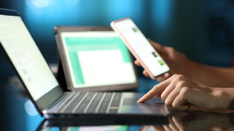 person operating multiple devices