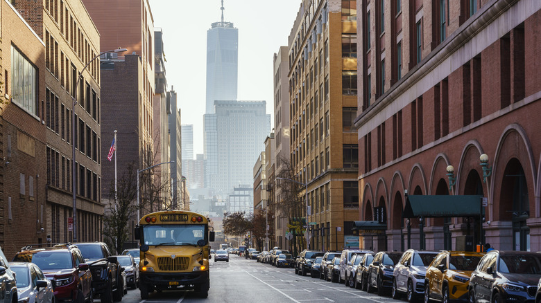 A parked up New York City street with the World Trade Center in the background