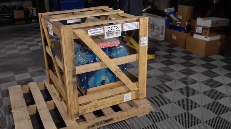 Crate engine in wooden box on wooden pallet