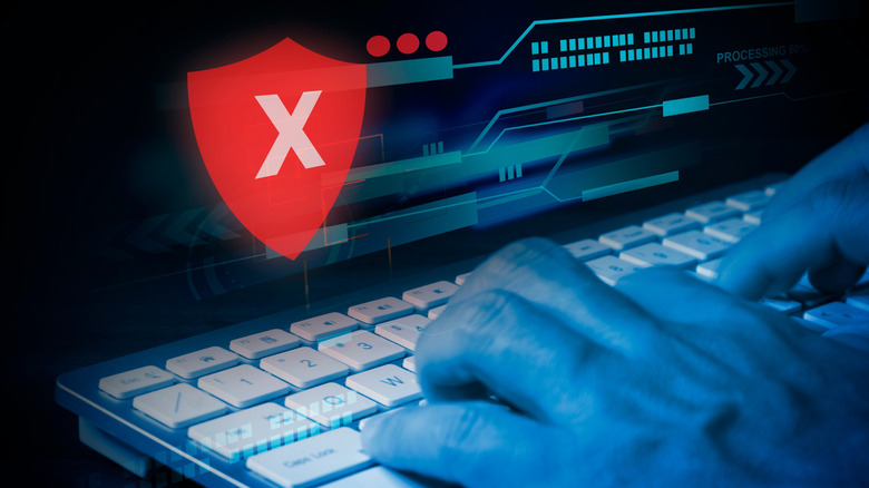 A person on the computer receives an access denied alert.