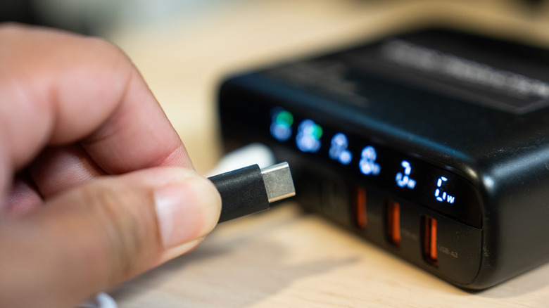 USB-C cable being plugged into a USB charger