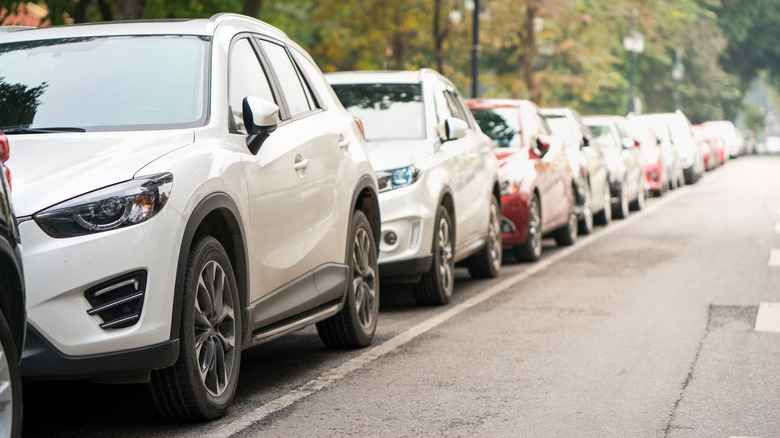 Line of cars parked on a residential street