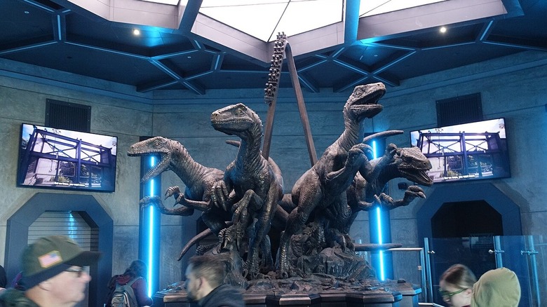The raptor statue inside VelociCoaster ride