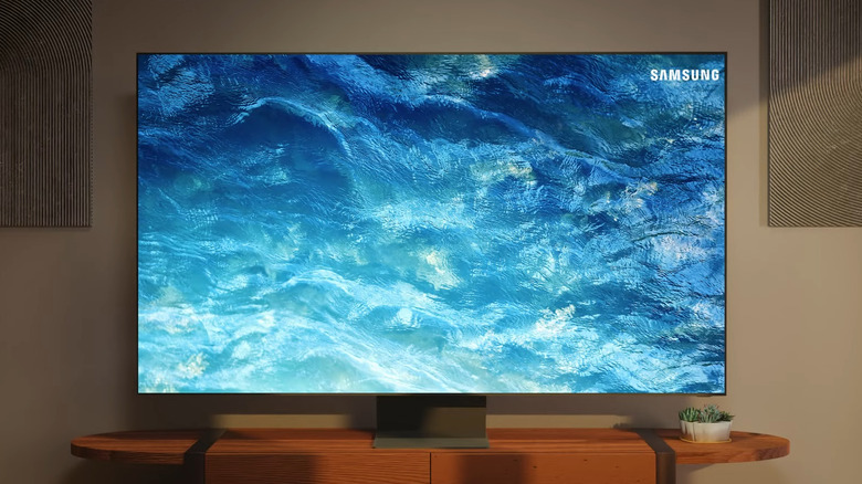 Samsung TV in living room showing a blue wallpaper
