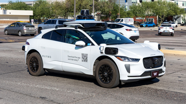 Waymo robotaxi on road.