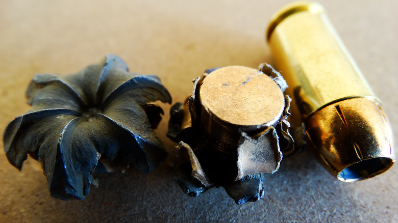 Hollow point bullets and expanding shells