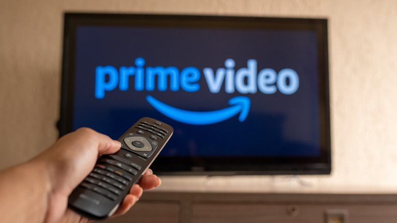 Person using remote control to navigate Prime Video