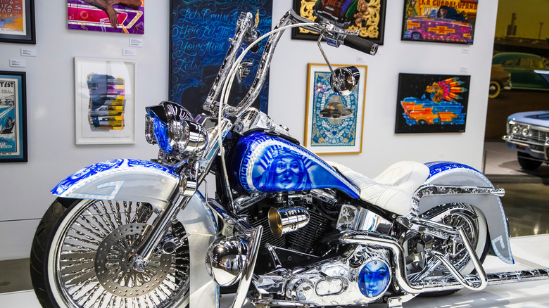 A customized Harley-Davidson motorcycle with ape hanger handlebars on display