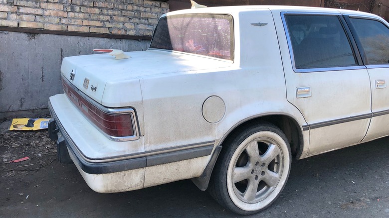 Dodge Dynasty with clearly visible rubber strips on the doors and rear bumper, whitewall tires