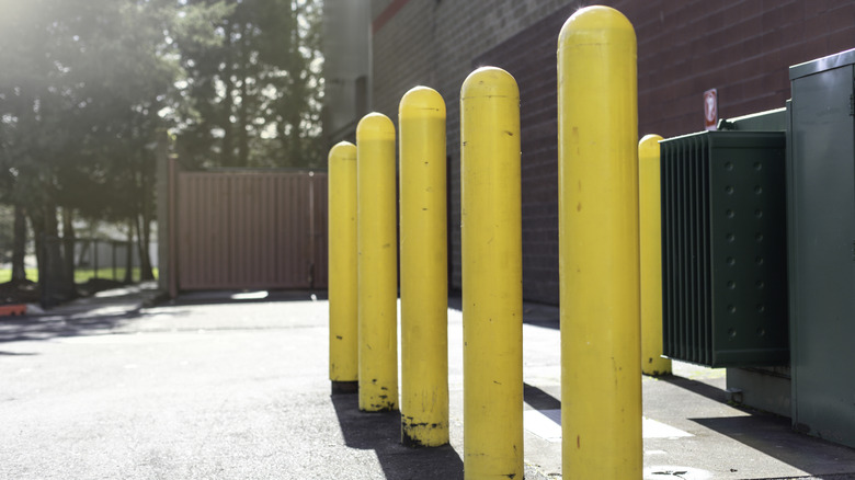 Yellow bollards for parking and restriction in a parking lot
