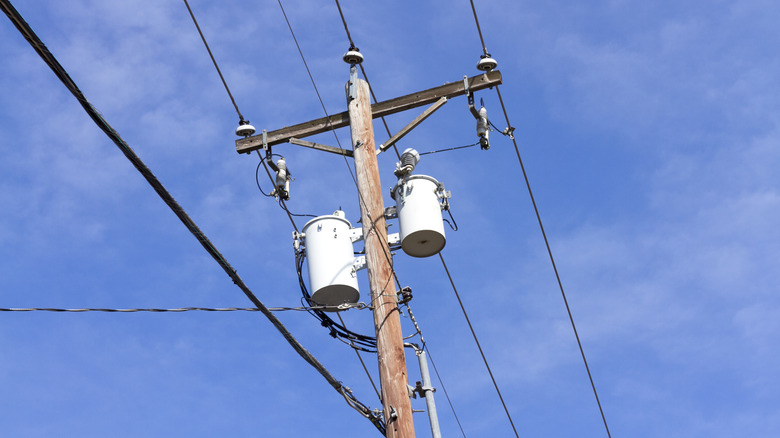 Two pole-mount transformers on power line