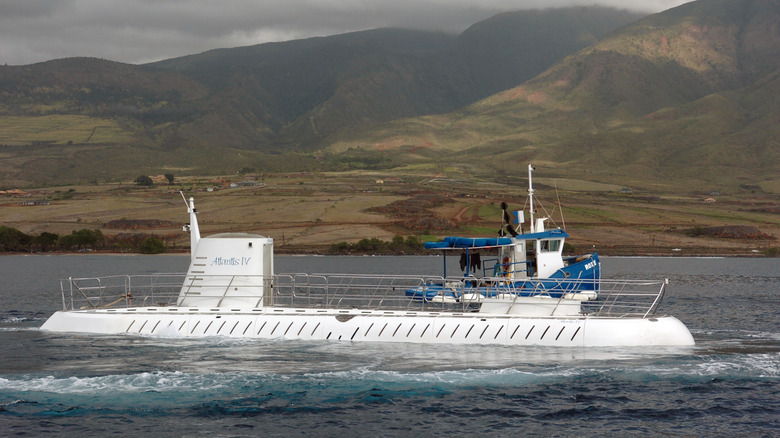 Atlantis IV submarine half submerged in water