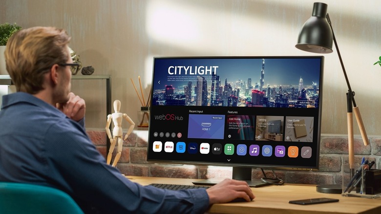 A man using LG monitor at his desk