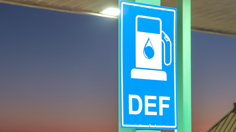 Light blue DEF sign photographed in the evening