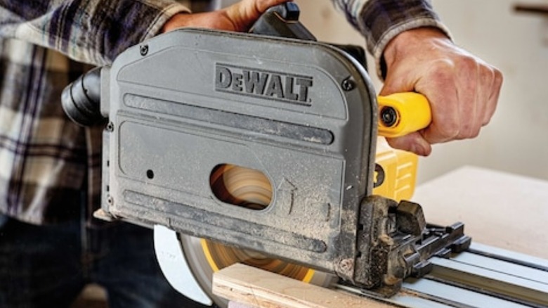 Person using Dewalt track saw