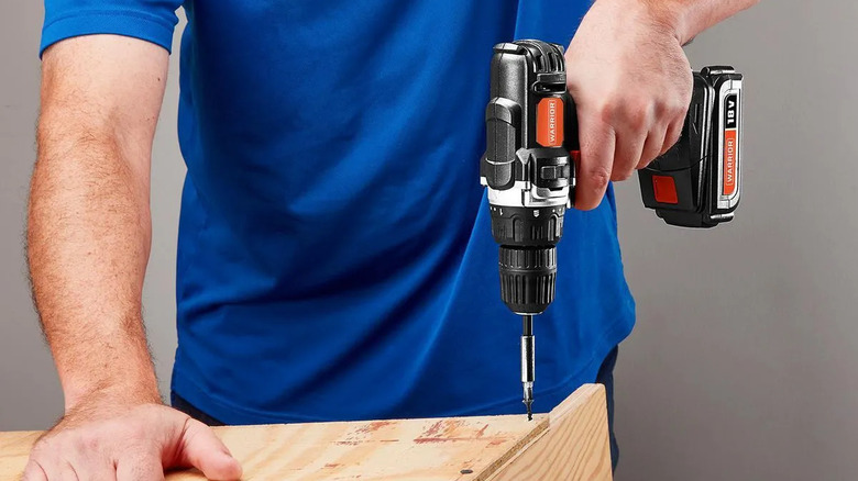 Man using a Warrior 3/8 inch drill/driver