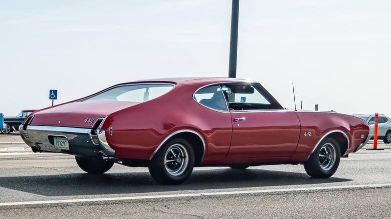 Red 1968 Oldsmobile 442 in parking lot