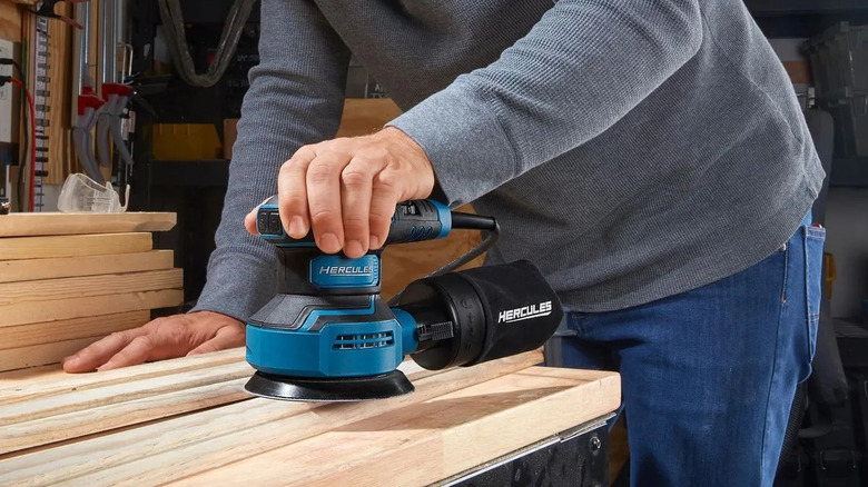 Man using Hercules orbital sander
