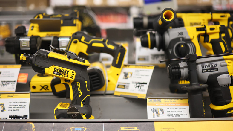 Various DeWalt tools on the shelves at Home Depot