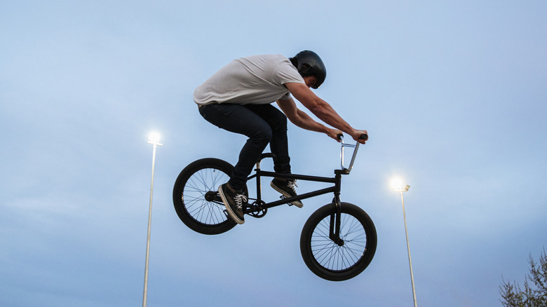 A person on a BMX bike in the air