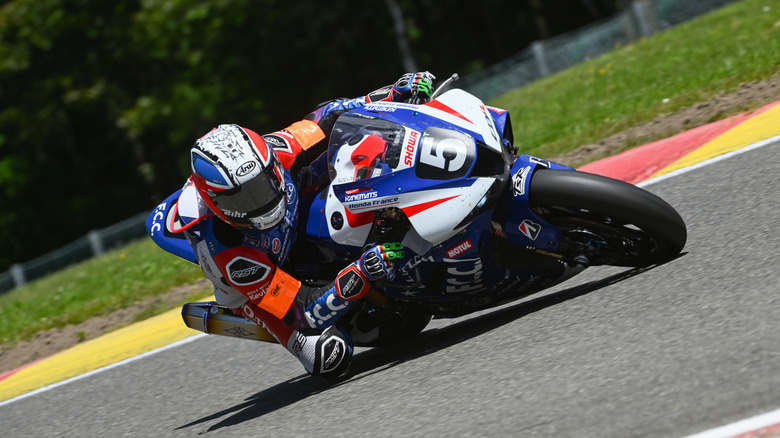 Honda CBR going round corner on racetrack