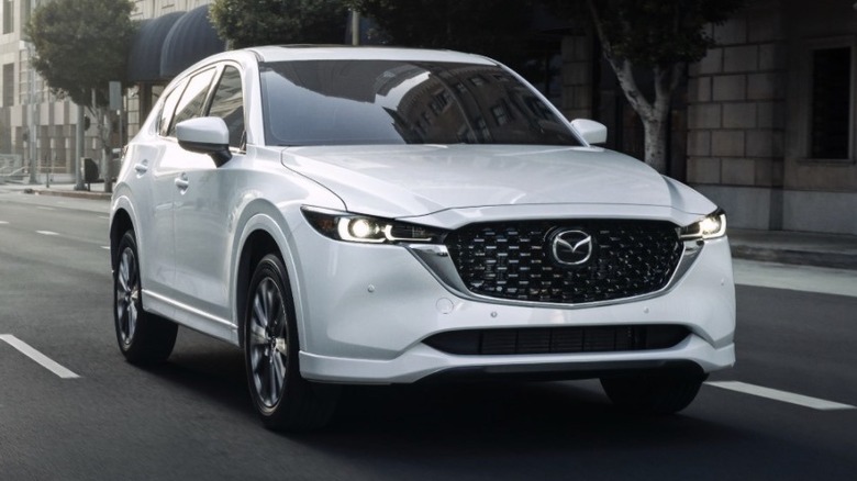 mazda c-5 on city street