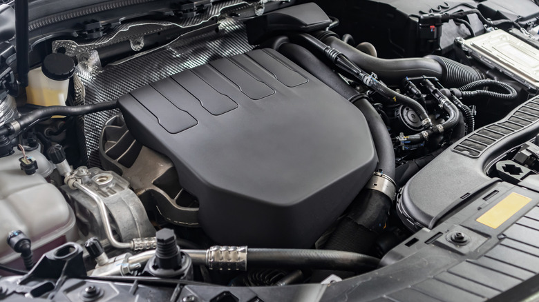 An unbranded engine with a black plastic engine cover