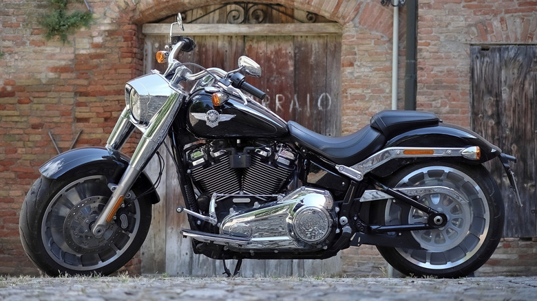 Harley-Davidson Fat Boy 114 parked in front of brick wall