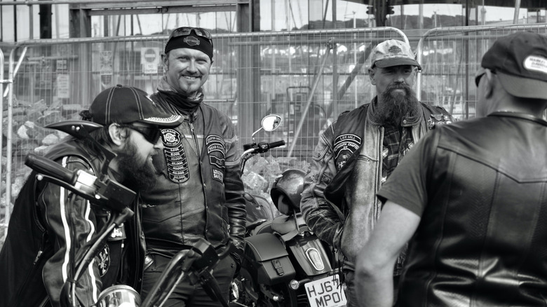 Hells Angels Plymouth Chapter members talking near their bikes