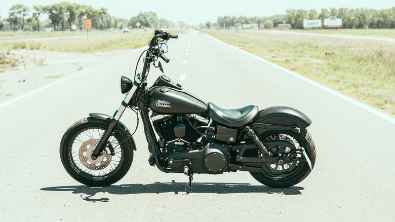 Black Harley Davidson Dyna Street Bob standing in the middle of the road