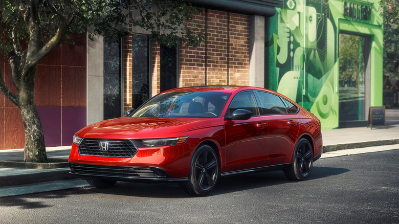 Front 3/4 shot of a parked 2025 Honda Accord in red