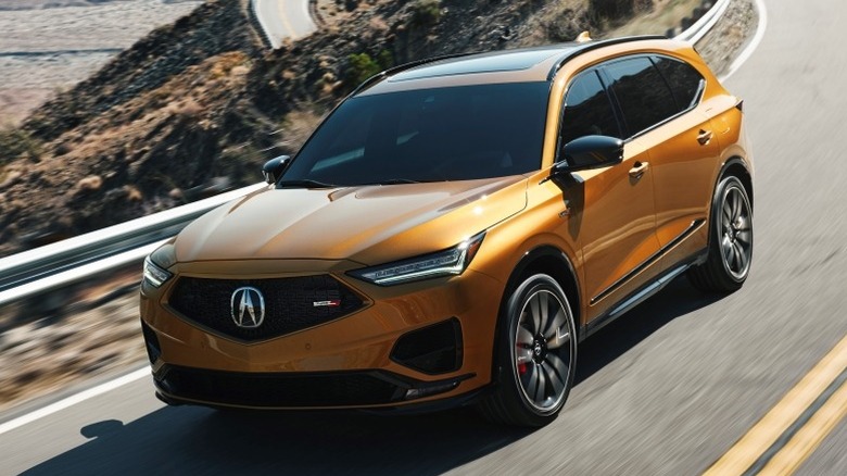 Acura MDX Type S driving down a winding mountain road
