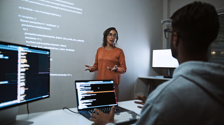 Two people working on open source project