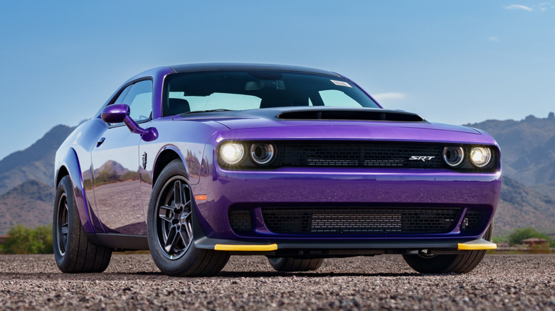 Purple SRT Hellcat on dirt road