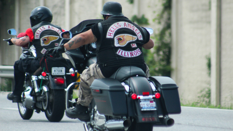 Two Hells Angels bikers riding motorcycles on a highway