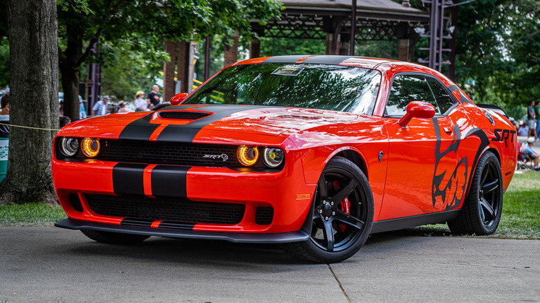 Red and black Dodge Challenger SRT Hellcat at a car show