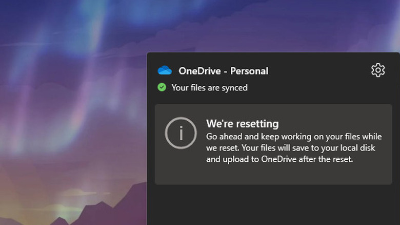 OneDrive panel showing resetting message