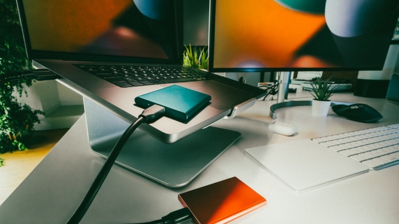 A laptop connected to multiple external devices