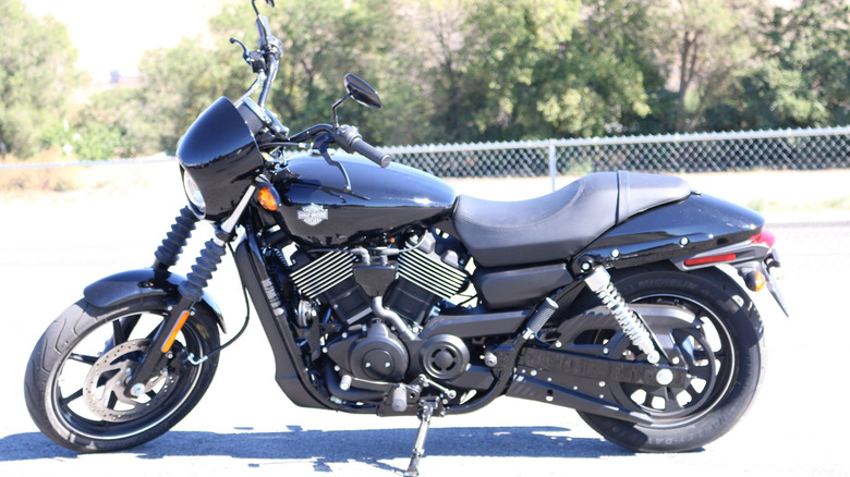 2014 Harley-Davidson Street 750 parked in front of a fence