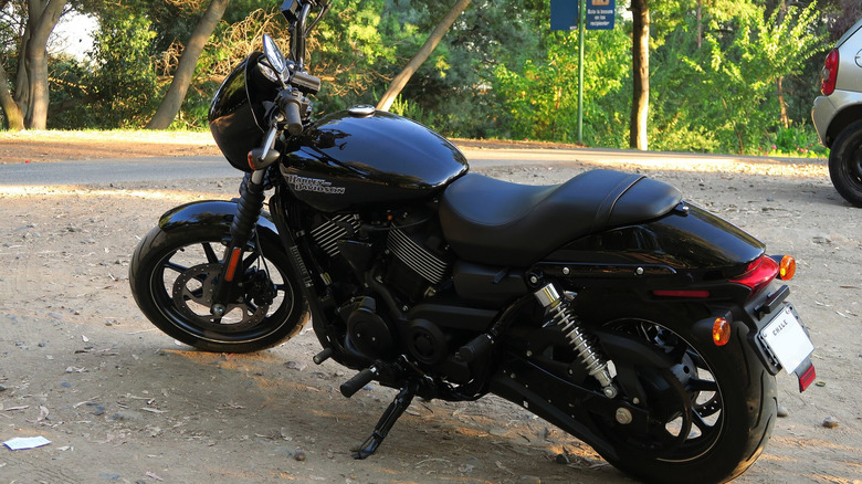 Rearview of a black Harley Davidson Street 750 on a side road