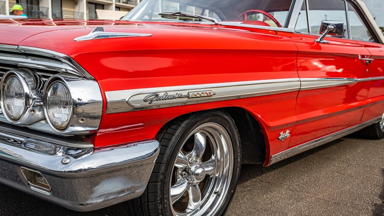 Red 1964 Ford Galaxie 500 on display at a car show