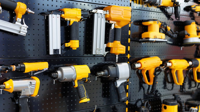 Drills and other power tools on display for sale in a store